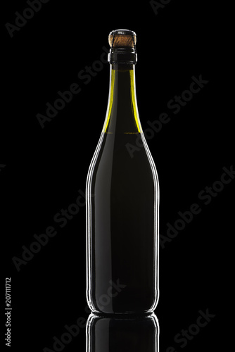 a bottle of sparkling wine on a black