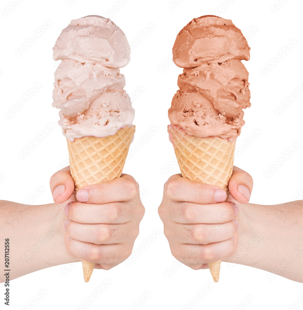Different tastes of ice cream in a cone waffle. Isolated on white background. Chocolate and milk ice cream. Ice cream in hand. Different tastes of ice cream in a cone waffle. Isolated on white background. Chocolate and milk ice cream. Ice cream in hand.