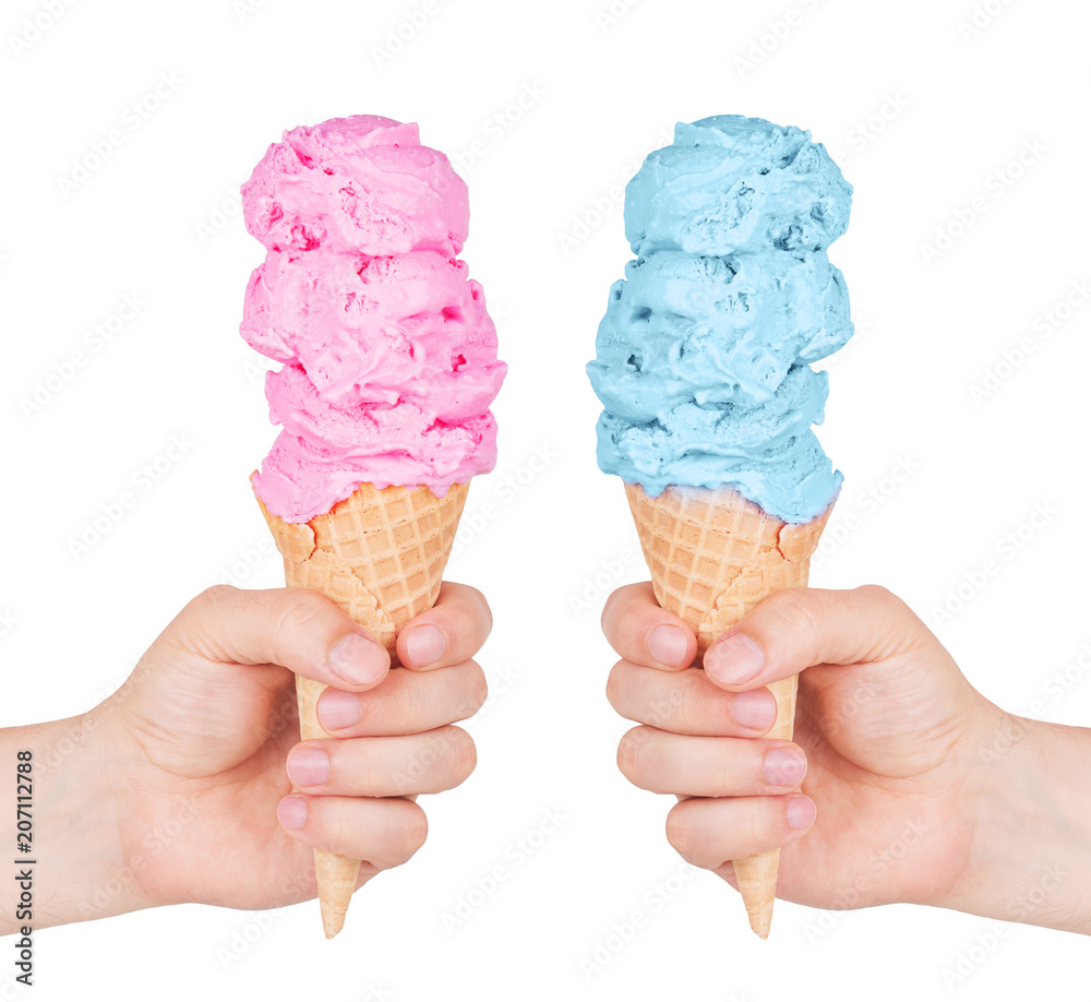 Different tastes of ice cream in a cone waffle. Isolated on white background. Strawberry and blueberry ice cream. Ice cream in hand. Different tastes of ice cream in a cone waffle. Isolated on white background. Strawberry and blueberry ice cream. Ice cream in hand.