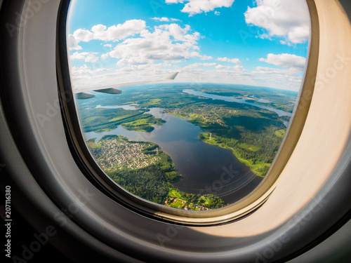 View of the planet Earth through the airplane porthole © Victoria