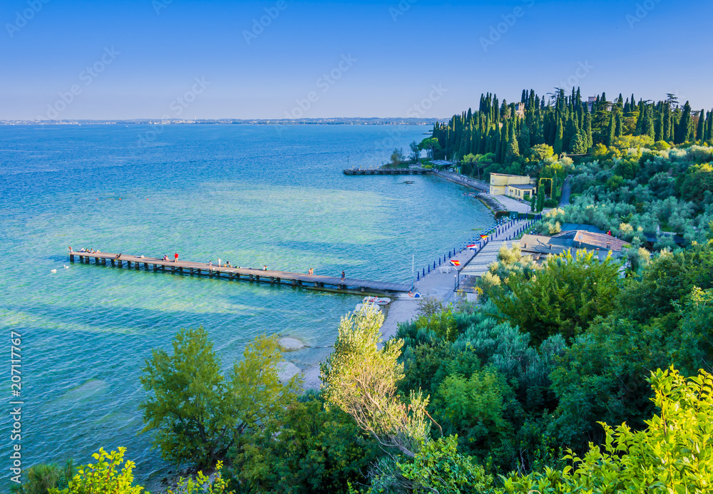 Scenic view of Sirmione beach, a charming little town located on the shores of Lake Garda, nothern Italy
