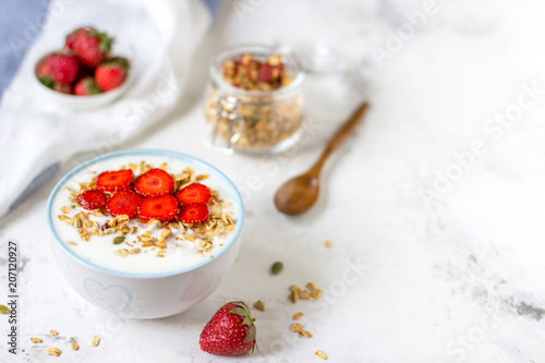 Granola with yogurt and strawberry, healthy breakfast