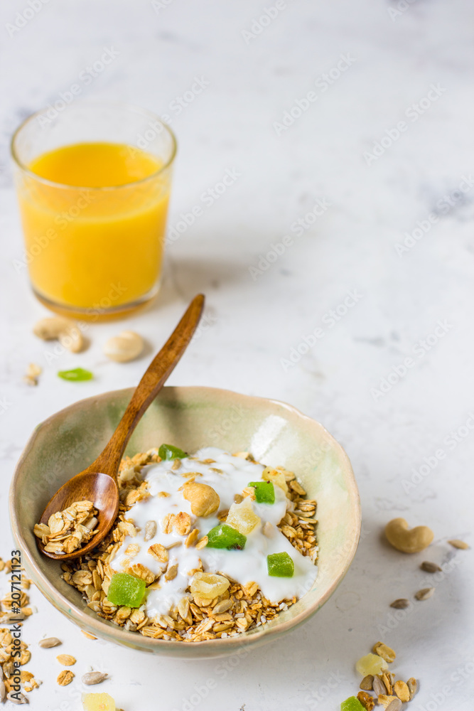 Granola with candied fruits and yogurt, healthy food Granola with candied fruits and yogurt, healthy food
