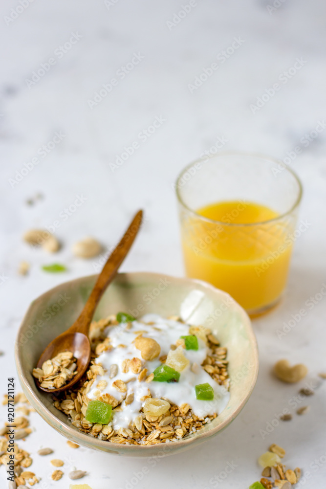 Granola with candied fruits and yogurt, healthy food