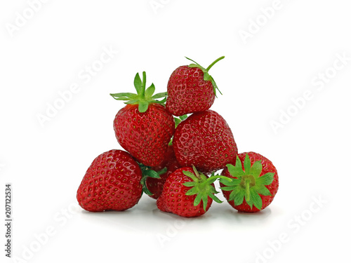 Close up of fresh strawberries shaped to a pyramid isolated on white background