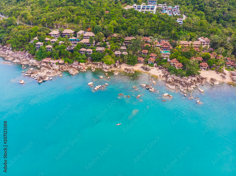 Aerial view of beautiful tropical beach and sea with palm and other tree in koh samui island