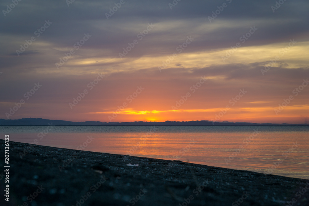 Sunset scene on the beach of the island of Ometepe.