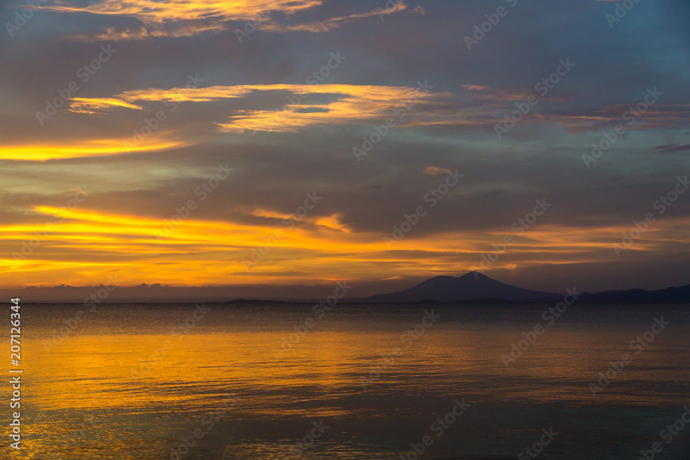 Golden sunset on the beach of the island of Ometepe.