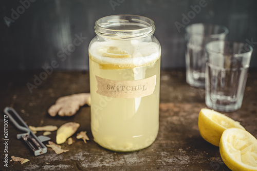 Switchel, homemade drink with ginger, apple vinegar, honey and lemon photo