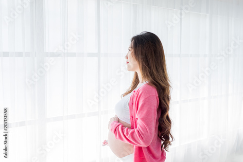 Free Download pregnant woman holding baby shoes - GFXLoad