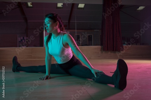 Female dancer exercising in dance studio