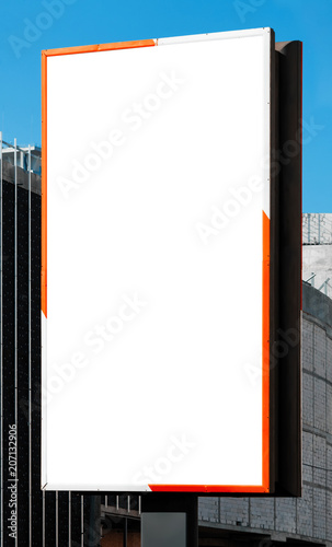 Blank vertical billboard on direct sunlight. photo
