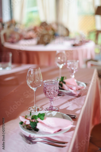 Wedding tables set for banquet or wedding event catering. Party celebration wedding concept. Flowers wedding decoration of tables for guests of bride and groom. Table appointment event © ANR Production