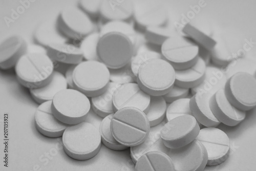 White pills isolated on white background
