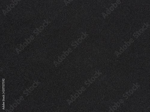 Foam rubber texture. Black sponge background. Dark polystyrene