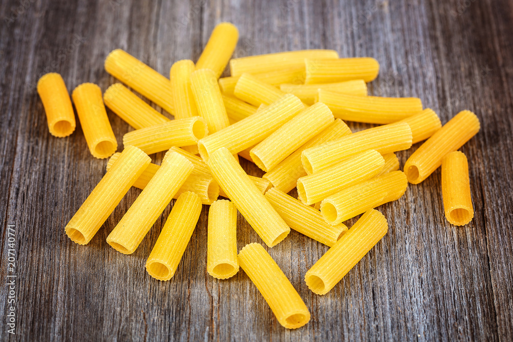 Pasta and vermicelli on a wooden background. Pasta and vermicelli on a wooden background.