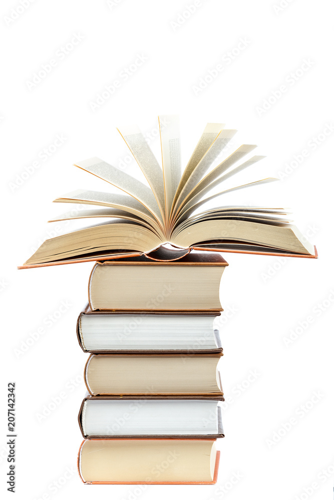 Naklejka premium Books in a stack on white background.