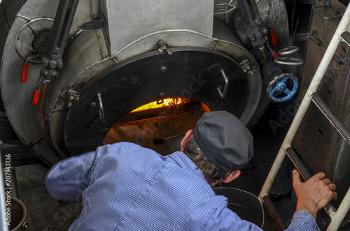fireman, stoker or boilerman . Powering a steam engine ship
