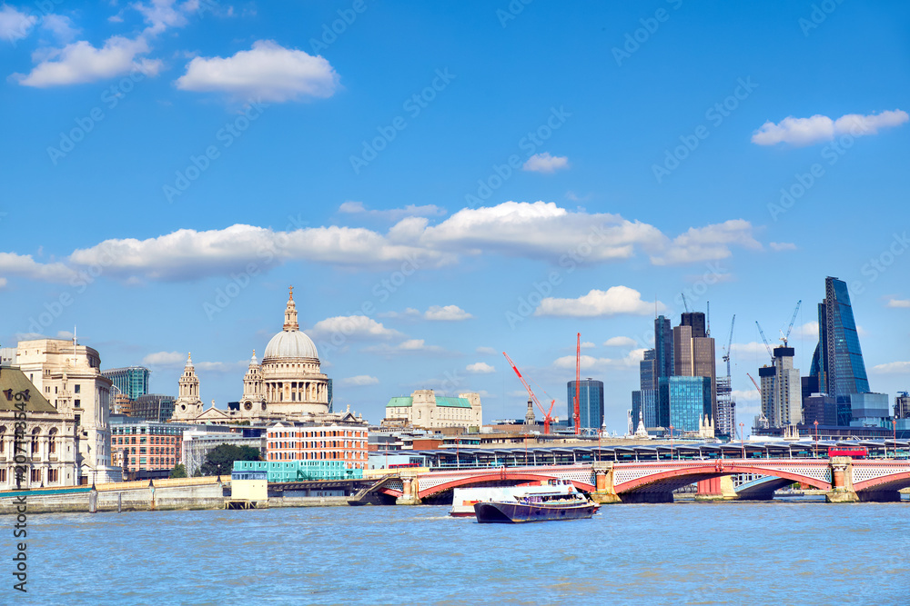 London, panoramic view over Thames river with St. Paul and London skyline on a bright day