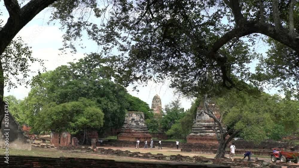 Phra Nakhon Si Ayutthaya Province / Thailand - May 28 2018 : tourist at Ayutthaya Historical Park slow motion shot Phra Nakhon Si Ayutthaya Province / Thailand - May 28 2018 : tourist at Ayutthaya Historical Park slow motion shot