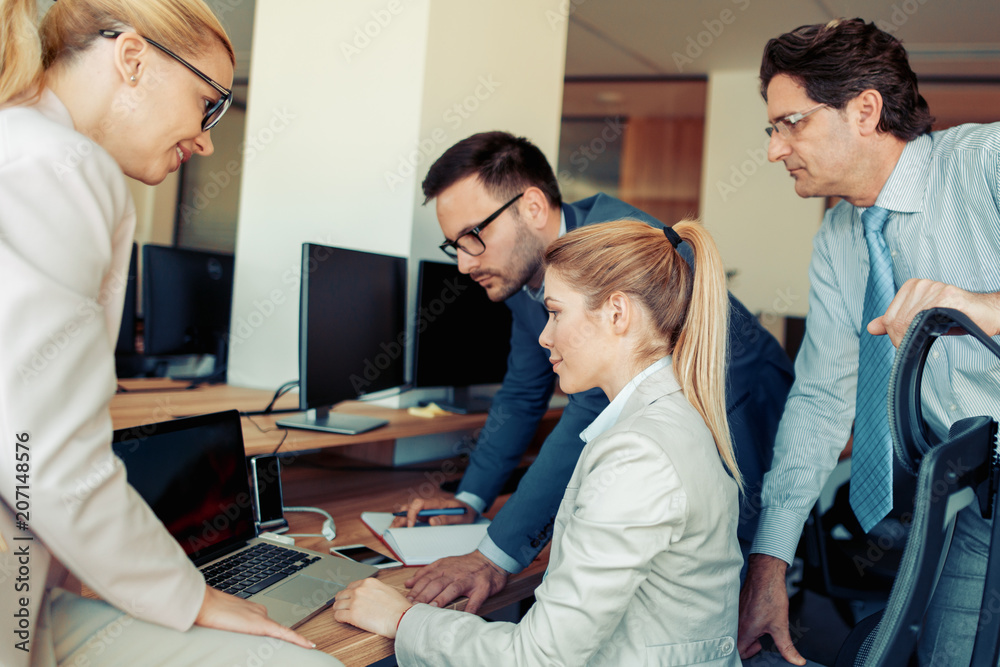 Business people working together in modern office Business people working together in modern office