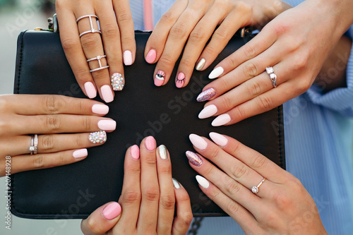 Different fashionable and trendy manicure with design on girl s hands.
