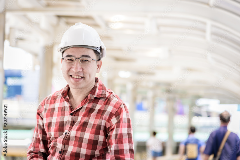 Asian business and engineer man with red scott shirt has planning and working for design buiding and city. Asian business and engineer man with red scott shirt has planning and working for design buiding and city.