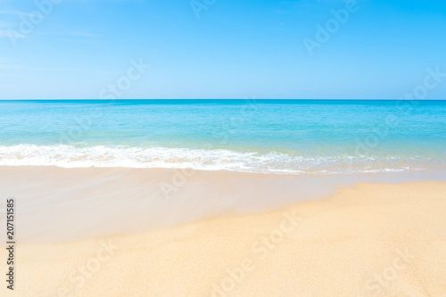 Beautiful sandy beach and tropical sea with blue sky in summer day. © AePatt Journey