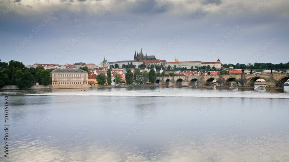 Pleasure boats on the River Vitava, with the Charles Bridge and St. Vitus Cathedral in the distance, Prague, Czech Republic, Europe - T/Lapse Pleasure boats on the River Vitava, with the Charles Bridge and St. Vitus Cathedral in the distance, Prague, Czech Republic, Europe - T/Lapse