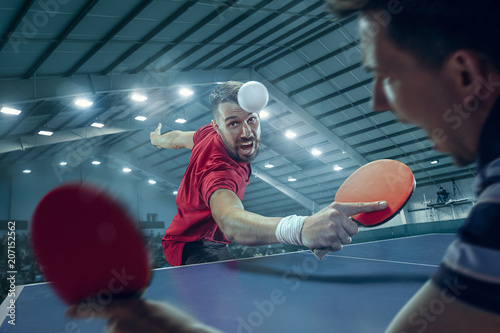 Fotografie The table tennis player serving