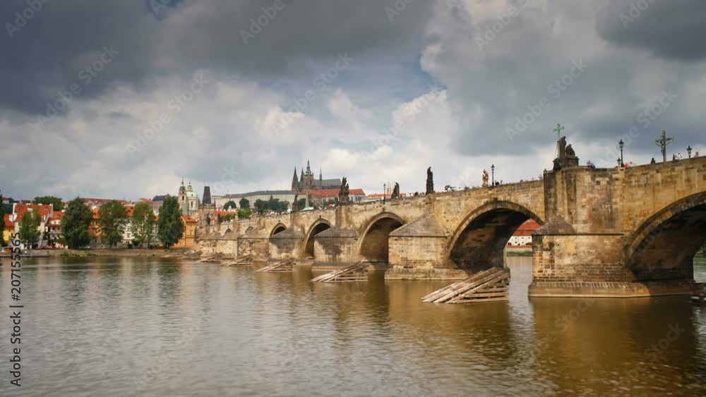 Charles Bridge (Karluv Most) Prague, Czech Republic, with St. Vitus Cathedral and the Castle district in the  background -T/Lapse