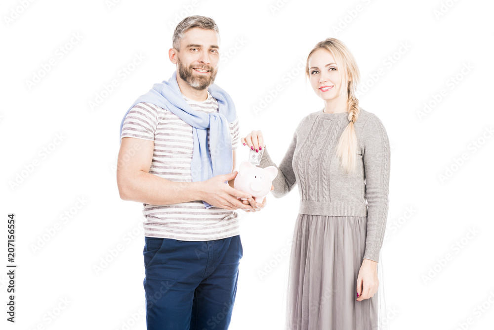Portrait of young pretty couple with piggy bank Portrait of young pretty couple with piggy bank
