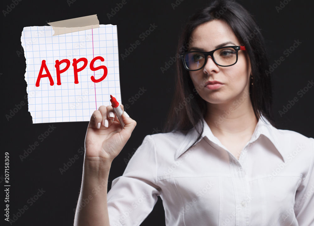 The concept of marketing, technology, the Internet and the network. A young businessman shows what is important for business: APPS The concept of marketing, technology, the Internet and the network. A young businessman shows what is important for business: APPS