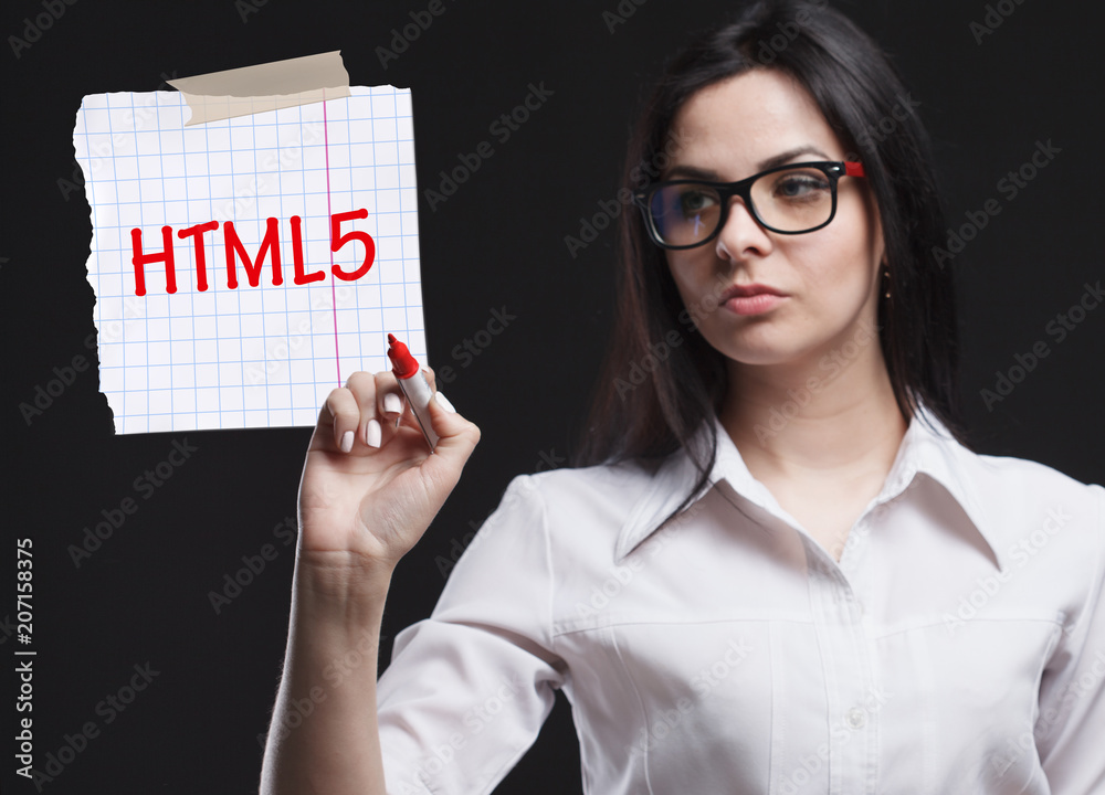 The concept of marketing, technology, the Internet and the network. A young businessman shows what is important for business: HTML5 The concept of marketing, technology, the Internet and the network. A young businessman shows what is important for business: HTML5