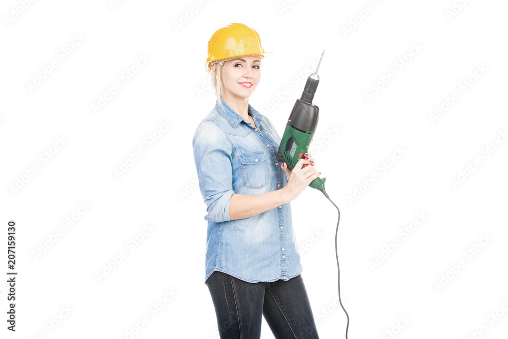 Portrait of attractive female constructor in helmet with hand drill smiling at camera on white background Portrait of attractive female constructor in helmet with hand drill smiling at camera on white background