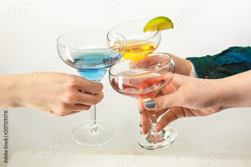 The male and female hands with exotic cocktails