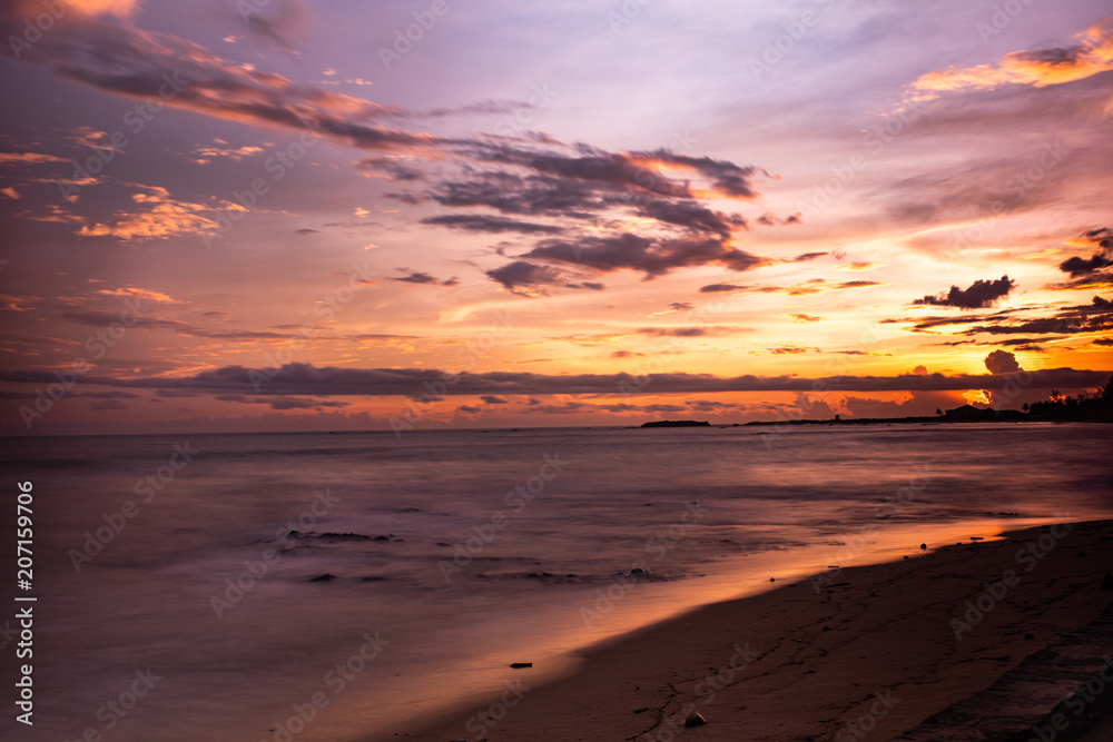 Beautiful sunset at calm beach in Bengal bay, Myanmar
