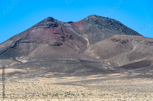 Red volcanic crater on Jandia Peninsula in Fuerteventura, Spain