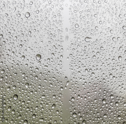 Wet glass background. Rain on the glass