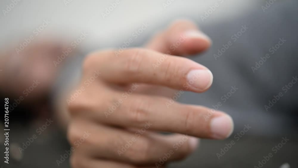 Asian stress handsome man smoking,Thailand people,Depressed man concept,He worry about work of company Asian stress handsome man smoking,Thailand people,Depressed man concept,He worry about work of company