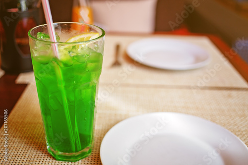 Herbal drink with ice and a slice of lemon