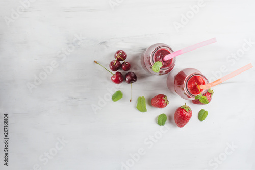 Fruit cocktail or smoothies with fruit on a light background. With empty space for writing