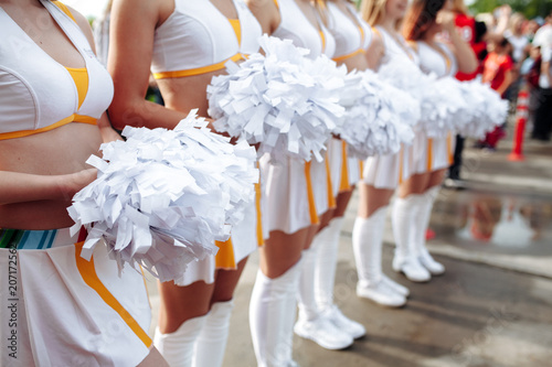 Bilde på lerret Cheerleaders in white Uniform Holding Pom-Poms