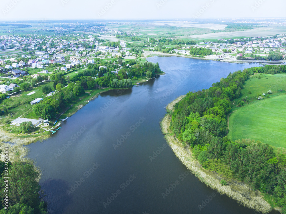 aerial view of river. small town on background