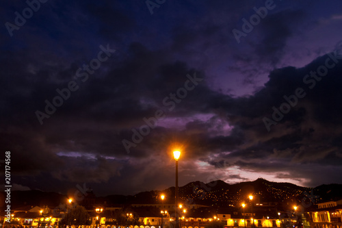 Night overview of homes and mountains in Cusco  Peru 