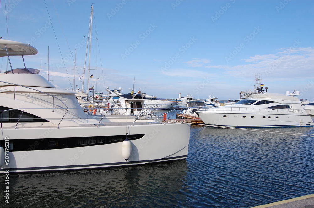 Fototapeta premium a black and white yacht stands at the sea moorage