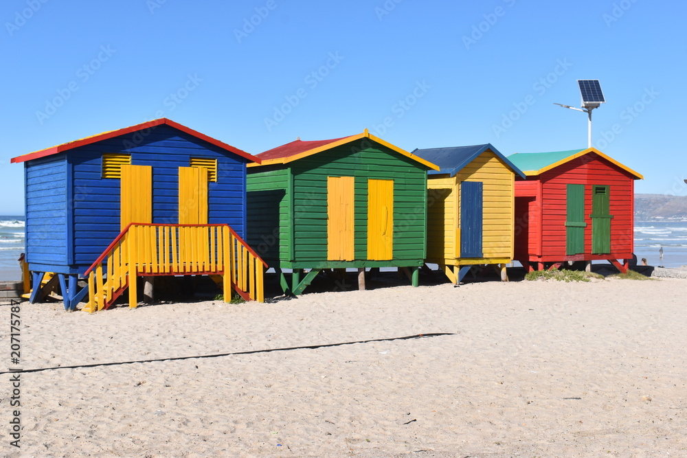 Colorful bathing cabins on the beach in Muizenberg in Cape Town, South Africa Colorful bathing cabins on the beach in Muizenberg in Cape Town, South Africa