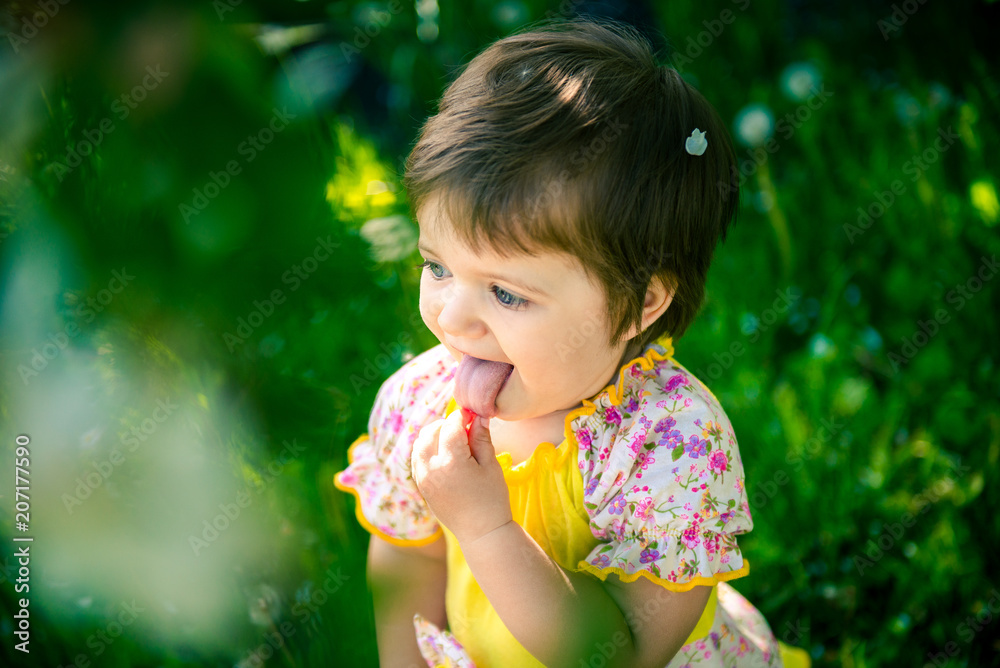 little girl in summer in the park. Portrait of a cute little girl in summer. Children's Day June 1. The first day of summer
