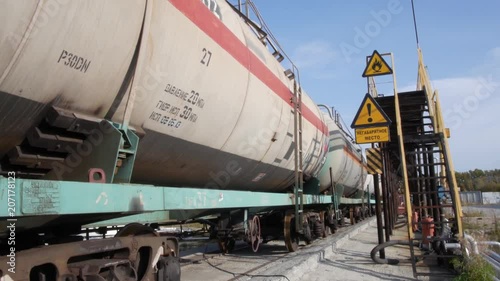 Tank cars at oil depot. Stock. Cars with fuel on the rails at the tank farm photo