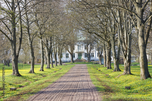 Avenue and a gravelled footpath leading to the queen Victorias hotel and rest home outside the city Borgholm at the island Oland in Sweden